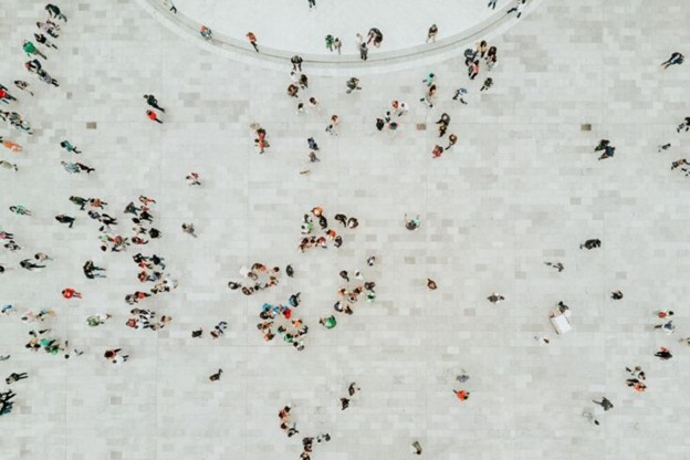 Decorative image showing an aerial view of people in a city 